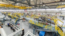 Sikorsky employees building CH-53K aircraft utilizing 3-D work instructions, new titanium machining centers with multi-floor ergonomic platforms.