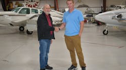 Howard Siedlecki, former owner of Sunshine Aviation Services, with current owner Patrick Peterson (pictured at right).