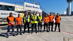 Michalis Panagoulias (center) began as a delivery boy at Goldair Handling before earning several promotions, including his current position as corporate health and safety manager.